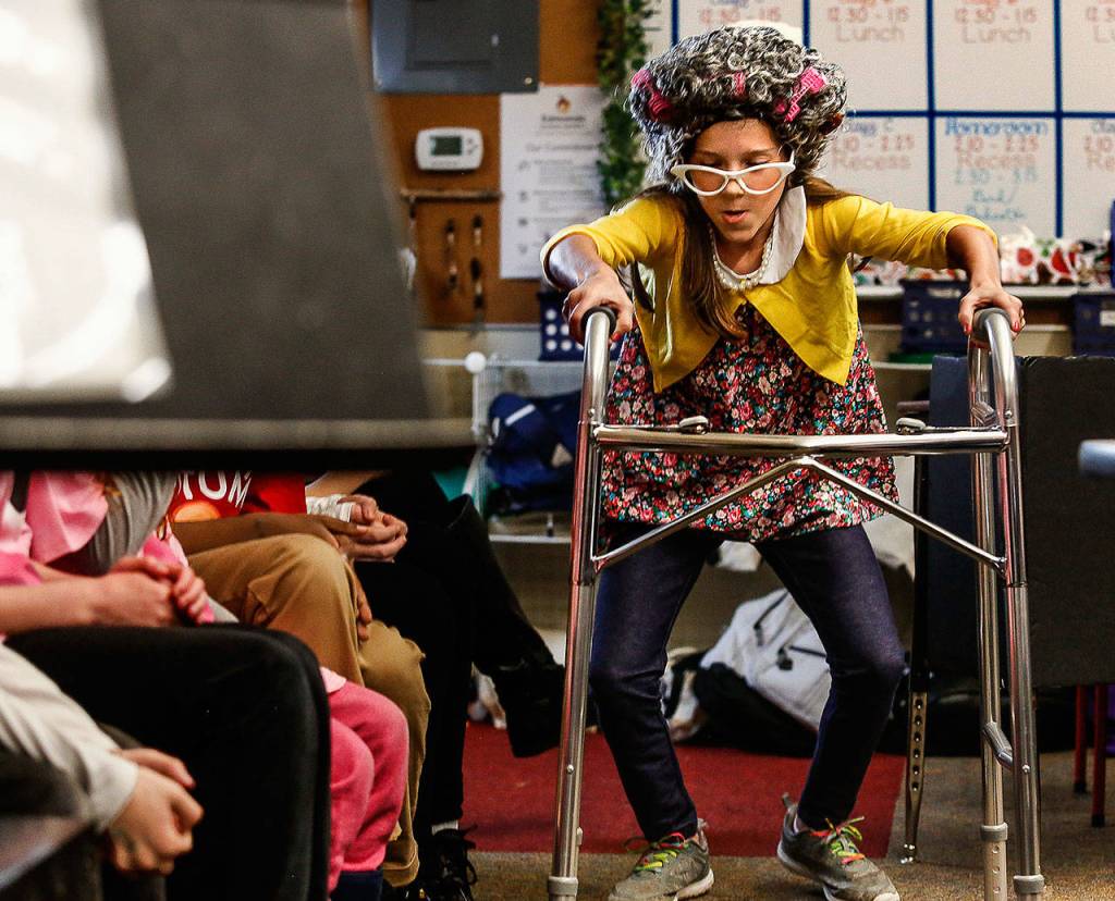 After testifying, Granny Wolf, played by Eden Young, struggles through the crowded courtroom to get back to her seat.(Dan Bates / The Herald)