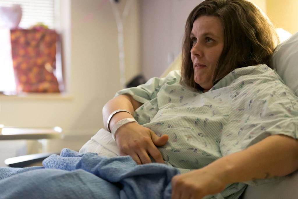 Amanda Perry, a mother of three, was hit by a suspected impaired driver last month while stalled on I-5. (Kevin Clark / The Herald)