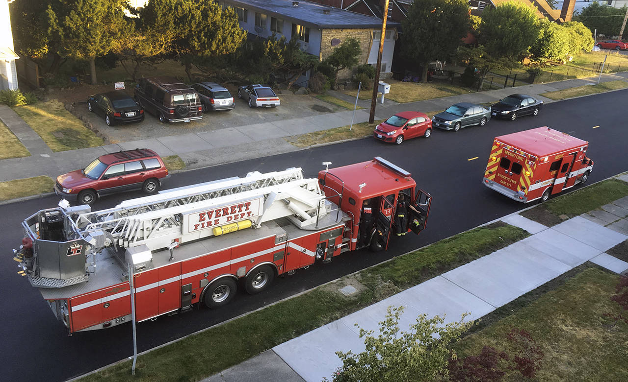 Firetruck and ambulance on Rucker Ave. in Everett. (Sue Misao / Herald file)