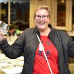 Edmonds City Council Member and Edmonds Senior Center board member Adrienne Fraley-Monillas helps gets things set up for an Oct. 25 fundraising breakfast for the Edmonds Senior Centers capital campaign. (Contributed photo)