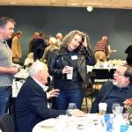 Jack Faris (seated left) and John Medina (seated right) visit with Tom Sanger and Beth Sanger at an Oct. 25 fundraising breakfast for the Edmonds Senior Centers capital campaign. (Contributed photo)