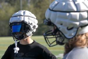 Glacier Peak football players wear Guardian Caps on their helmets during a practice on Oct. 4 at Glacier Peak High School in Snohomish. (Kevin Clark / The Herald)