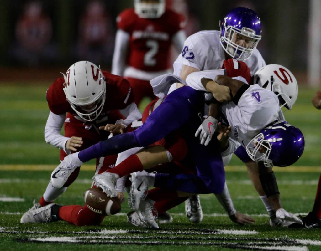 Garfields Rodriguez Green (4) fumbles the ball to be recovered by Snohomish during a Week 10 playoff game on Nov. 2, 2018, at Veterans Memorial Stadium in Snohomish. Snohomish won 42-35. (Andy Bronson / The Herald)