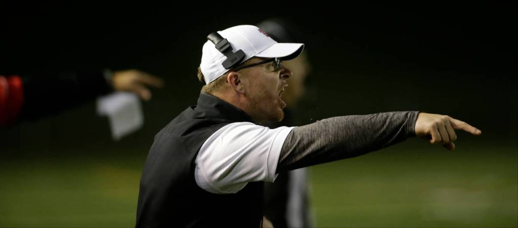 Snohomish head coach Joey Hammer yells instructions to his team during a Week 10 playoff game against Garfield on Nov. 2, 2018, at Veterans Memorial Stadium in Snohomish. Snohomish won 42-35. (Andy Bronson / The Herald)