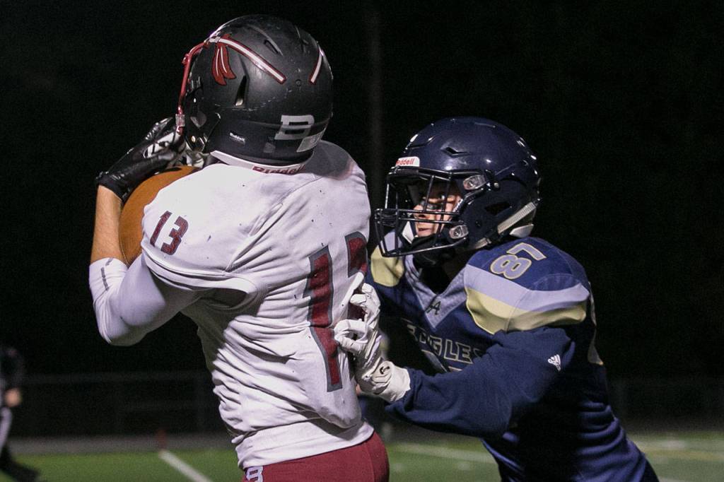 Bethels Cameron Parker (13) catches a touchdown with Arlingtons Dylan Simmons defending during a Week 10 playoff game on Nov. 2, 2018, at Arlington High School. Bethel won 50-15. (Kevin Clark / The Herald)