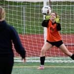 Goalie Cheyenne Rodgers keeps her eyes on the ball as she blocks a kick during shootout drills with the Snohomish High soccer team on Friday, Nov. 2, 2018 in Snohomish. (Andy Bronson / The Herald)