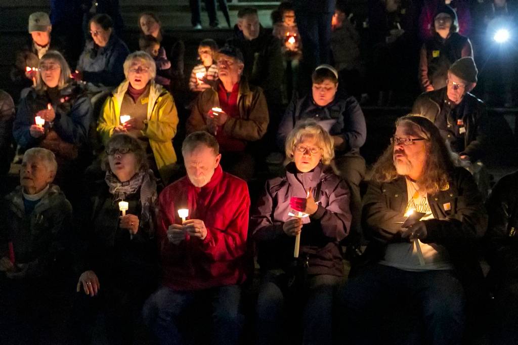 Citizens gather for an interfaith candlelight vigil on Nov. 1. (Kevin Clark / The Herald)