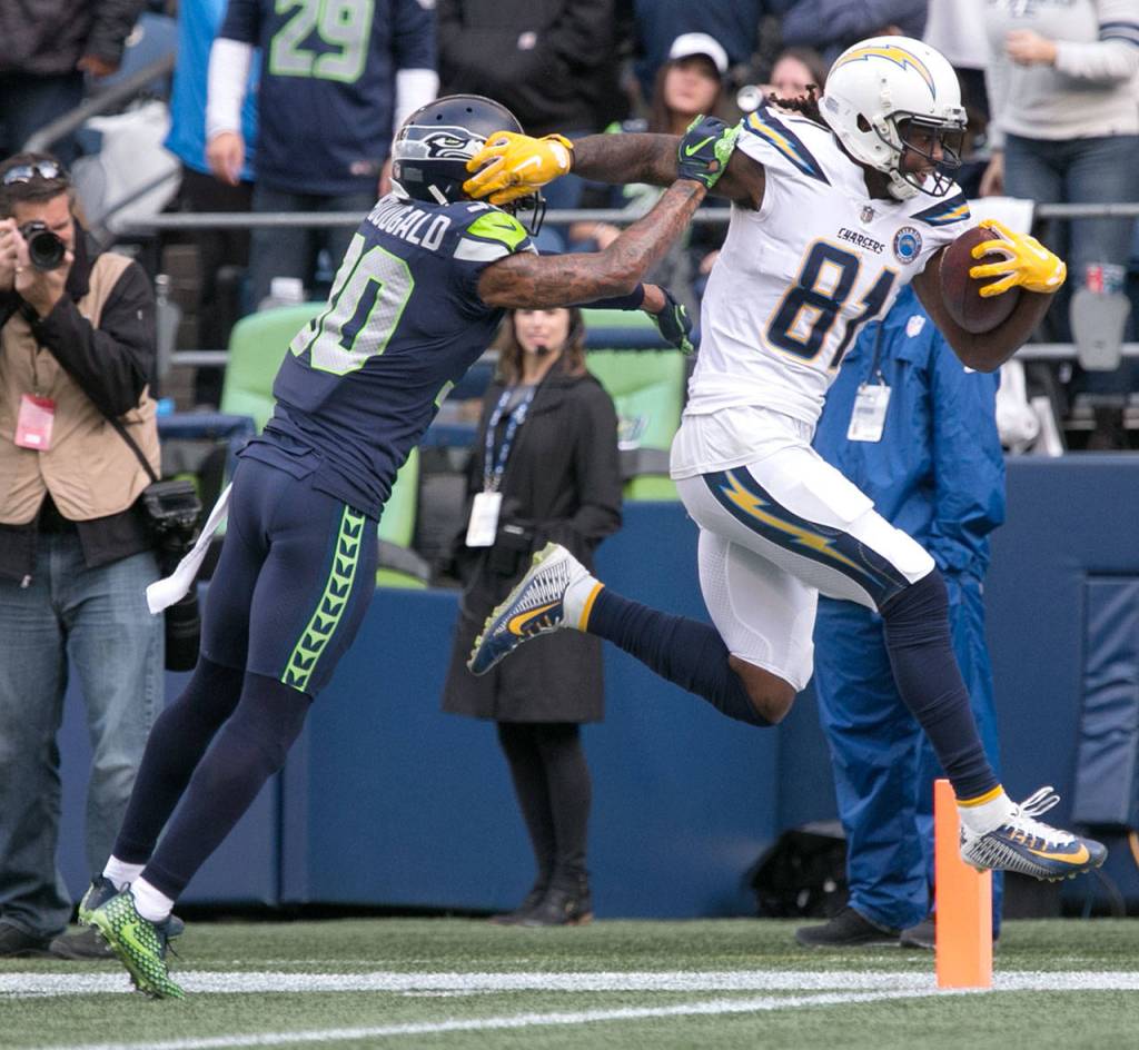 Chargers wide receiver Mike Williams crosses the goal line for a touchdown with Seahawks safety Bradley McDougald Sunday afternoon at CenturyLink Field in Seattle on November 4, 2018. Chargers won 25-17. (Kevin Clark / The Herald)