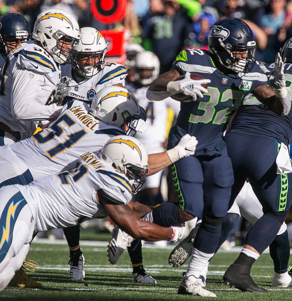 Seahawks running back Chris Carson rushes against the Chargers Sunday afternoon at CenturyLink Field in Seattle on November 4, 2018. Chargers won 25-17. (Kevin Clark / The Herald)