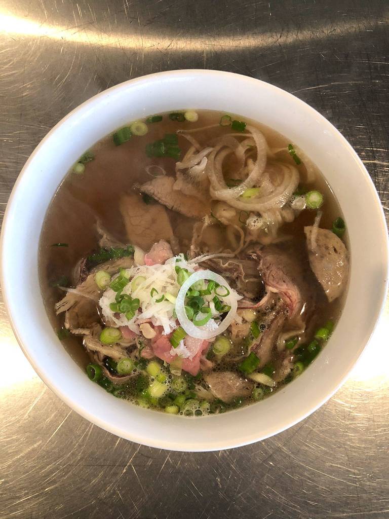 Basils special meat-lovers pho, called dac biet, has steak, flank, brisket, tendon, tripe and Vietnamese beef balls. (Andrew Pham)
