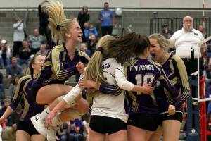 Lake Stevens celebrates a point during the District Volleyball Tournament Tuesday night at Bothell High School on November 6, 2018. Chargers won 25-17. (Kevin Clark / The Herald)