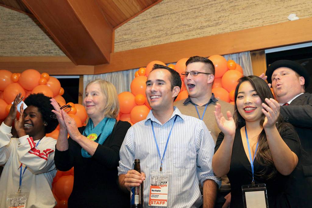 Supporters cheer during an election night party for Washington State Initiative 1639 on Tuesday in Seattle. (Genna Martin/seattlepi.com via AP)