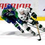 The Silvertips Bryce Kindopp (right) recovers the puck with Swift Currents Artyom Minulin trailing during Game 4 of the WHL Championship series on May 9, 2018, at Angel of the Winds Arena in Everett. (Kevin Clark / The Herald)