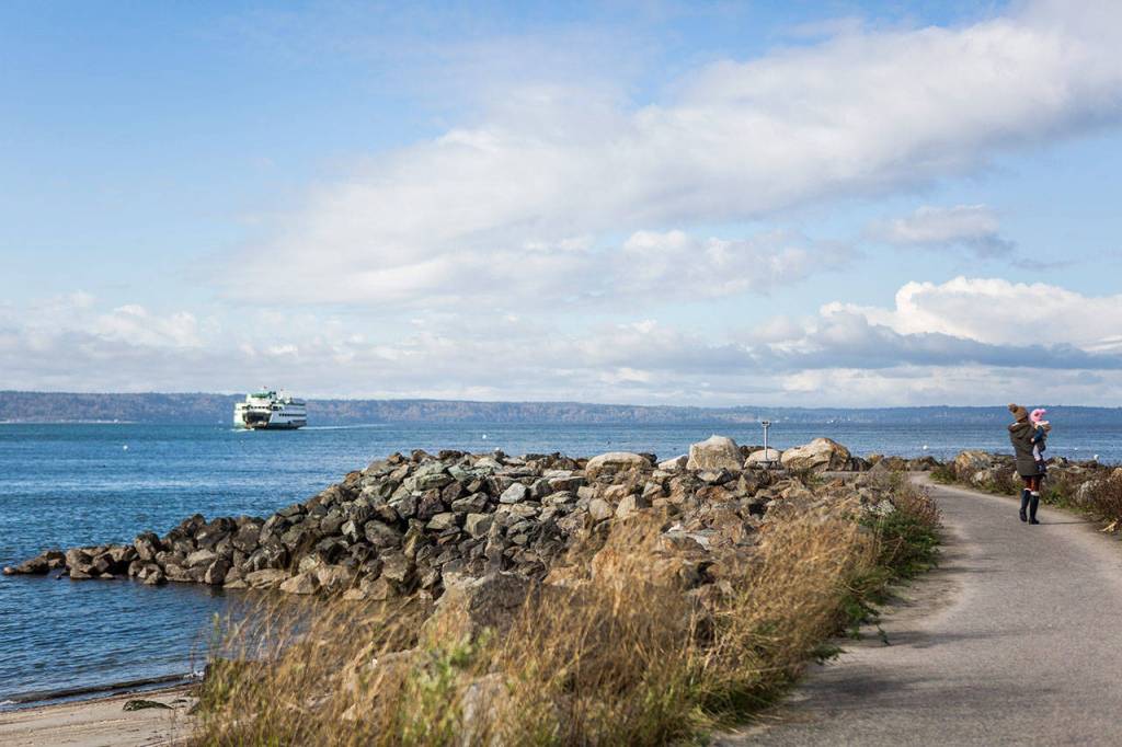 Megan Stinson holds her daughter Bellamie, 2, as they walk out to the lookout point at Bracketts Landing. (Olivia Vanni / The Herald)