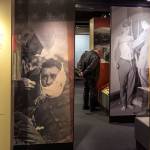 A museum-goer looks over the World War I exhibit at the Museum of History and Industry in Seattle. WWI America is up through Feb. 10. (Kevin Clark / The Herald)