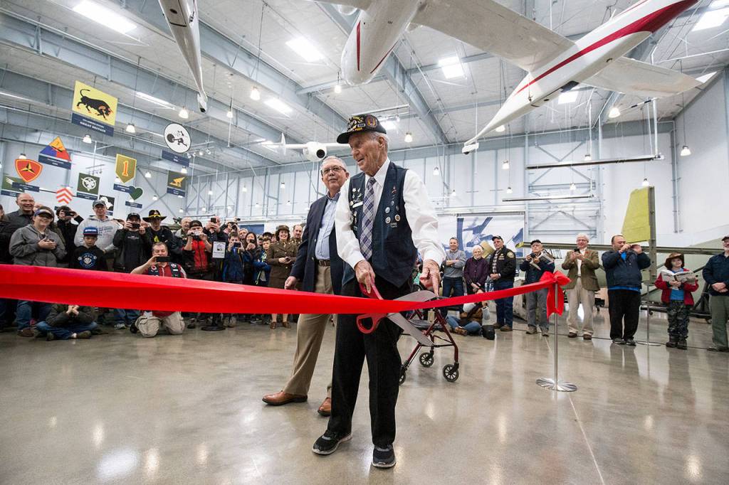 World War II veteran Art Unruh, 96, points out that the ceremonial scissors wont cut a ribbon in the new 30,000 foot hangar at the Flying Heritage & Combat Armor Museum at Paine Field on Saturday, Nov. 10, 2018 in Everett, Wa. (Andy Bronson / The Herald)