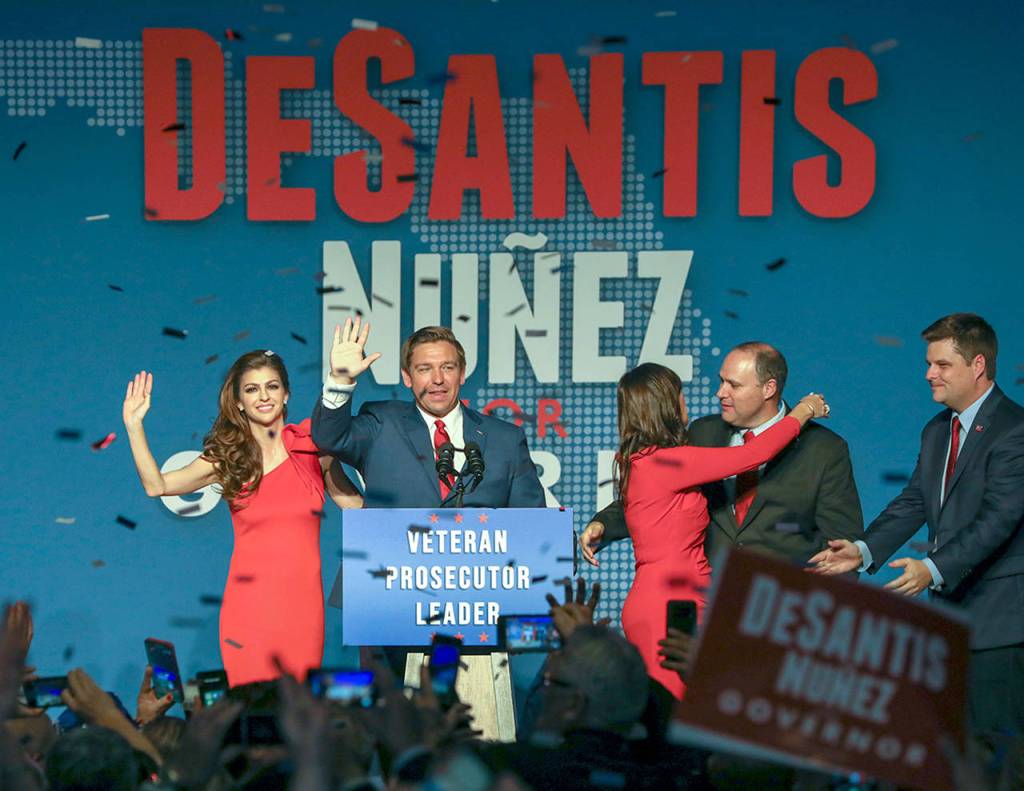 Republican Florida Governor-elect Ron DeSantis, center, waves to the supporters with his wife, Casey, left, and Republican Lt. Governor-elect Jeanette Nunez, third right, after thanking the crowd Tuesday, Nov. 6, 2018, in Orlando, Fla. DeSantis defeated Democratic candidate Andrew Gillum. (Chris Urso/Tampa Bay Times via AP)