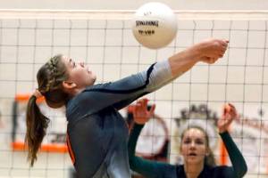 Monroes Tatum McGovern volleys against Jackson Tuesday night at Monroe High School on October 9, 2018. (Kevin Clark / The Herald)