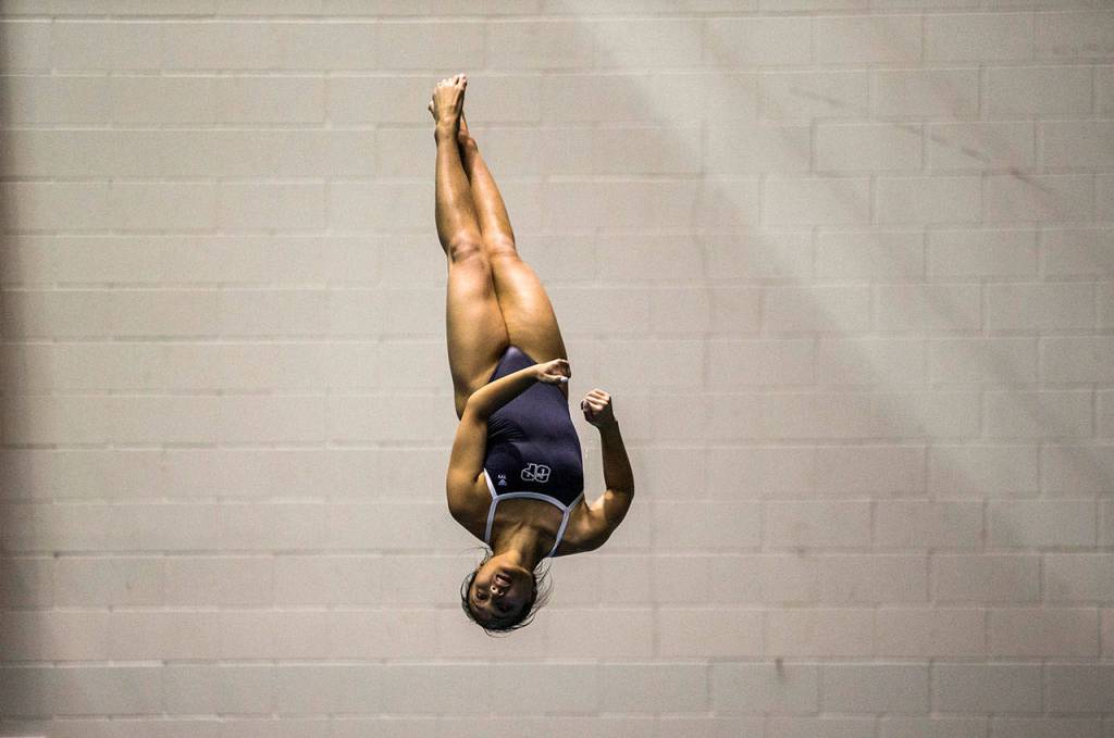 Glacier Peaks Ryzele Lagdaan competes in the 1-meter diving during the 4A state swimming and diving championships on Nov. 10, 2018, in Federal Way. (Olivia Vanni / The Herald)