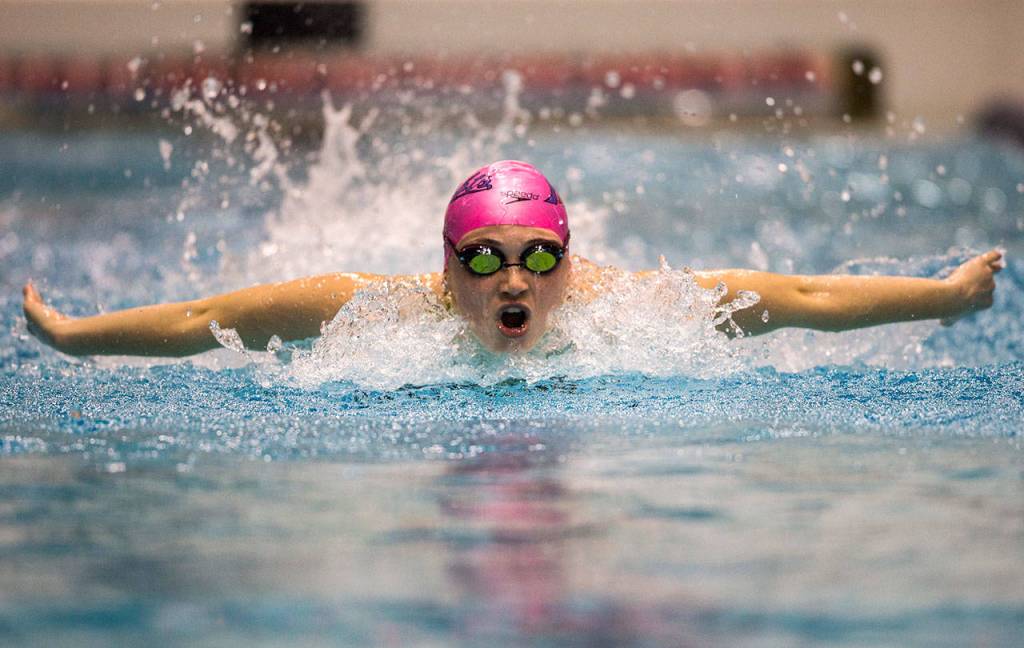 Kamiaks Ava Collinge 100-yard butterfly during the 4A state swimming and diving championships on Nov. 10, 2018, in Federal Way. (Olivia Vanni / The Herald)