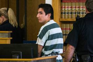 Brian Varela looks back at family and friends of Alyssa Noceda shouting, See you when you get out, in Snohomish County Superior Court on Thursday, Nov. 15, 2018 in Everett, Wa. Varela had just been sentenced to less than 3 years in prison, for third-degree rape and second-degree manslaughter. (Olivia Vanni / The Herald)