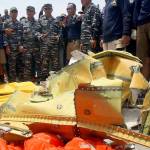 Navy personnel gather around debris recovered from the sea where a Lion Air Boeing 737 MAX 8 crashed Oct. 29. (AP Photo/Binsar Bakkara)