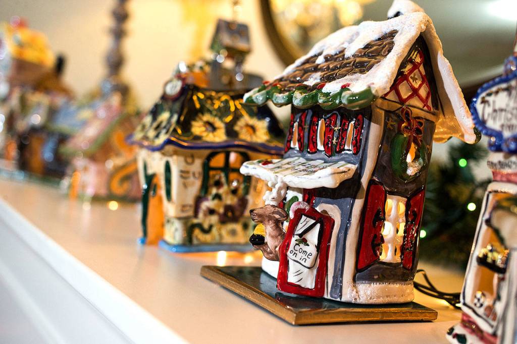Blue Sky ceramics line a fireplace mantel at Gary and Ardie McLeans home. (Andy Bronson / The Herald)