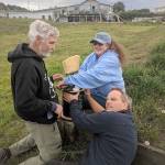 Howard Garrett (left), Susan Berta and Florian Graner roll out the long cable needed to install a hydrophone to listen to marine life. The research sound equipment is located at Bush Point in the sound path of killer whales and other marine mammals. (Photo provided)