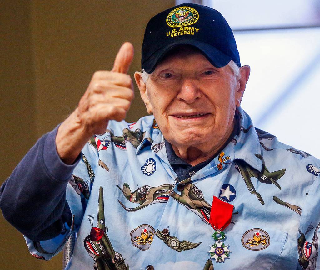 Peter Bellecy, 96, gives a thumbs-up after being awarded the French Legion of Honor medal Nov. 14 in Lynnwood. (Dan Bates / The Herald)