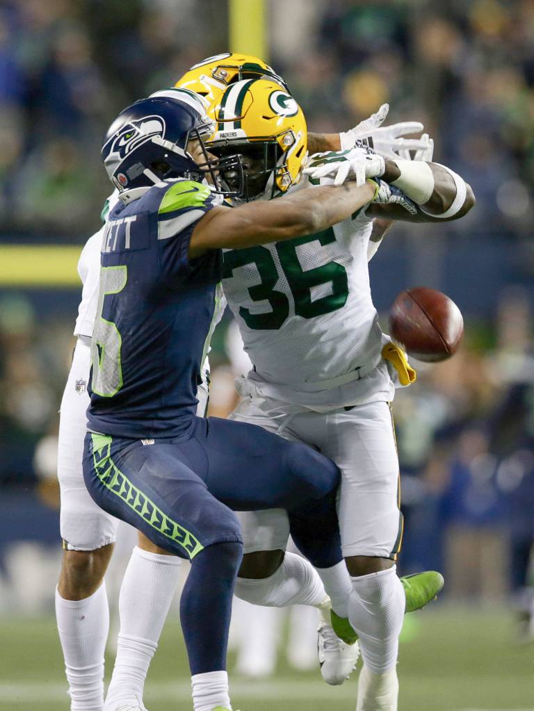 Green Bays Raven Greene is called for pass interference against Seattles Tyler Lockett during the Seahawks 27-24 win over the Packers on Thursday at CenturyLink Field in Seattle. (Andy Bronson / The Herald)