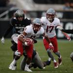Washington State wide receiver Easop Winston Jr. (8) tires to shake loose a Colordao defender during the second half of a game on Nov. 10, 2018, in Boulder, Colo. (AP Photo/David Zalubowski)