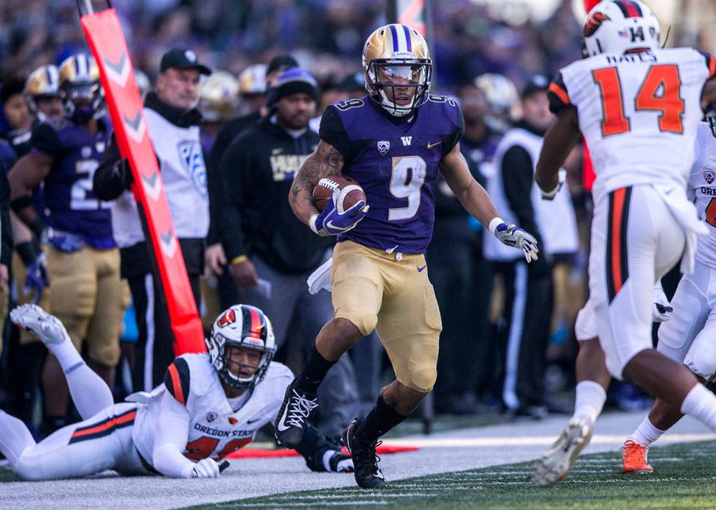 Washingtons Myles Gaskin escapes a tackle during the game against Oregon State on Saturday, Nov. 17, 2018 in Everett, Wa. (Olivia Vanni / The Herald)