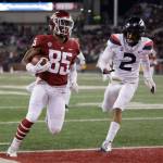 Washington State wide receiver Calvin Jackson Jr. (85) runs for a touchdown in front of Arizona cornerback Lorenzo Burns (2) during the first half of a game on Nov. 17, 2018, in Pullman. (AP Photo/Young Kwak)