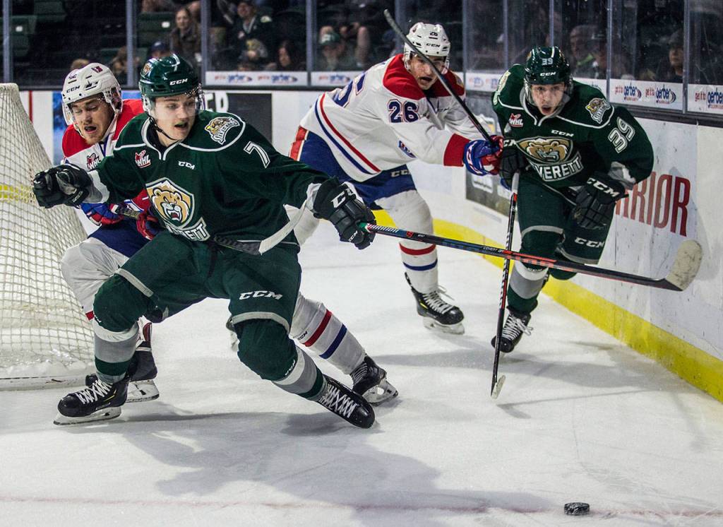 Silvertips Martin Fasko-Rudas and Gage Conclaves fight for the puck during the game against the Spokane Chiefs on Nov. 18, in Everett. (Olivia Vanni / The Herald)