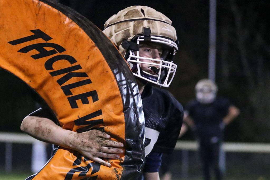 Connor Ewing of the U14 Lake Stevens Vikings returns a tackle wheel during a team practice Thursday at the Lake Stevens Boys Girls Club. (Kevin Clark / The Herald)