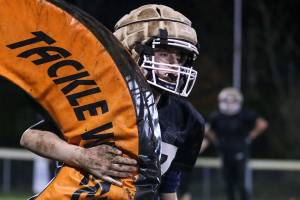 Connor Ewing return a tackle wheel Thursday night during practice at the Lake Stevens Boys and Girls Club on November 15, 2018. (Kevin Clark / The Herald)