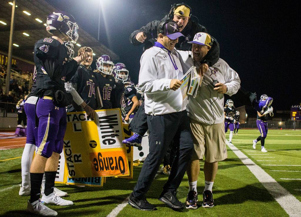 Lake Stevens coaches celebrate after a touchdown during the game against Graham Kapowsin on Saturday, Nov. 17, 2018 in Lake Stevens, Wa. (Olivia Vanni / The Herald)