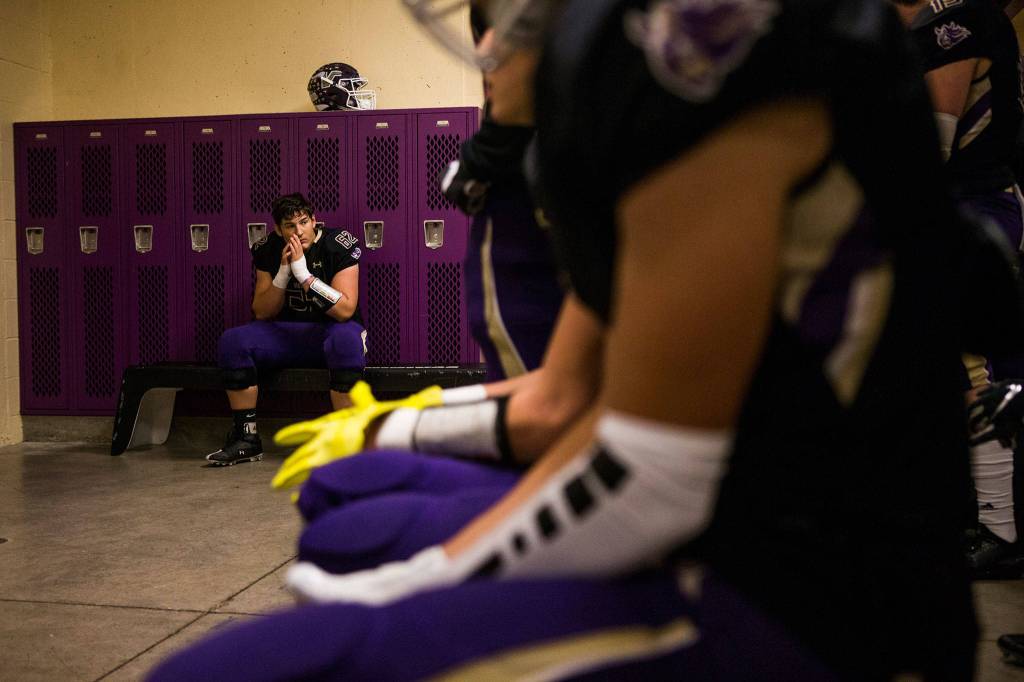Lake Stevens Wyatt Hall listens to his coach talk before the game against Graham Kapowsin on Saturday, Nov. 17, 2018 in Lake Stevens, Wa. (Olivia Vanni / The Herald)