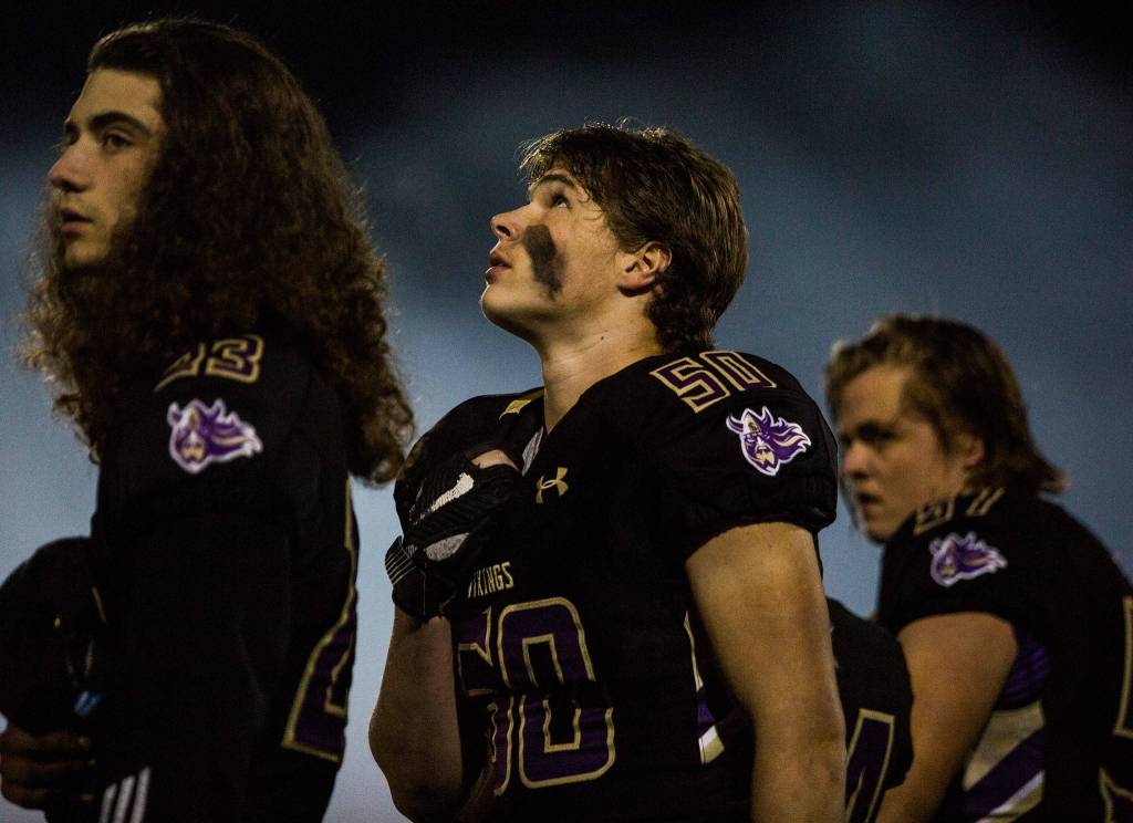 Lake Stevens Brandyn Roberts looks up during the national anthem before the game against Graham Kapowsin on Saturday, Nov. 17, 2018 in Lake Stevens, Wa. (Olivia Vanni / The Herald)