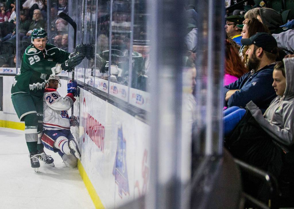Silvertips Wyatte Wylie slams Spokanes Eli Zummack into the wall during the game against the Spokane Chiefs on Sunday, Nov. 18, 2018 in Everett, Wa. (Olivia Vanni / The Herald)
