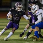 Lake Stevens Kasen Kitchen runs the ball during a 4A state quartefinal game against Graham-Kapowsin on Nov. 17, 2018, in Lake Stevens. (Olivia Vanni / The Herald)