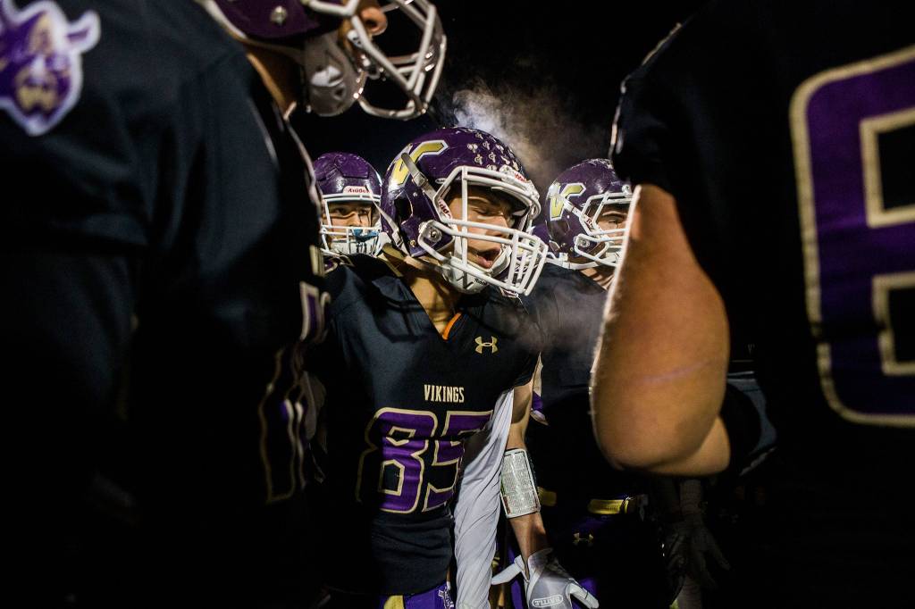 Lake Stevens Ty Hilton yells in the huddle before the game against Graham Kapowsin on Nov. 17 in Everett. Photo gallery <a href="https://www.heraldnet.com/sports/gallery-lake-stevens-beats-graham-kapowsin-in-state-quarterfinal/" target="_blank">here</a>. (Olivia Vanni / The Herald)