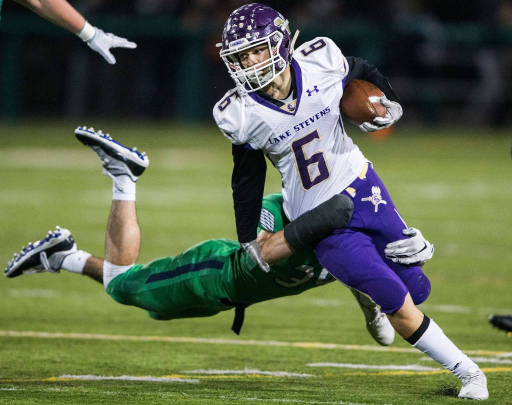 Lake Stevens Dallas Landeros runs through a tackle during the Class 4A state state semifinal game against Woodinville at Pop Keeney Stadium on Saturday, Nov. 24, 2018 in Bothell, Wa. (Olivia Vanni / The Herald)