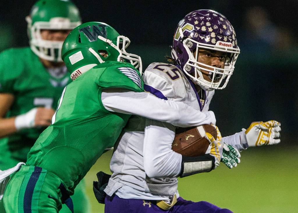 Lake Stevens Kasen Kinchen is tackled during the Class 4A state state semifinal game against Woodinville at Pop Keeney Stadium on Saturday, Nov. 24, 2018 in Bothell, Wa. (Olivia Vanni / The Herald)