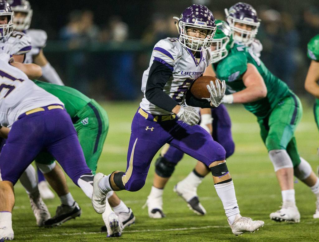 Lake Stevens Dallas Landeros runs the ball during the Class 4A state state semifinal game against Woodinville at Pop Keeney Stadium on Saturday, Nov. 24, 2018 in Bothell, Wa. (Olivia Vanni / The Herald)