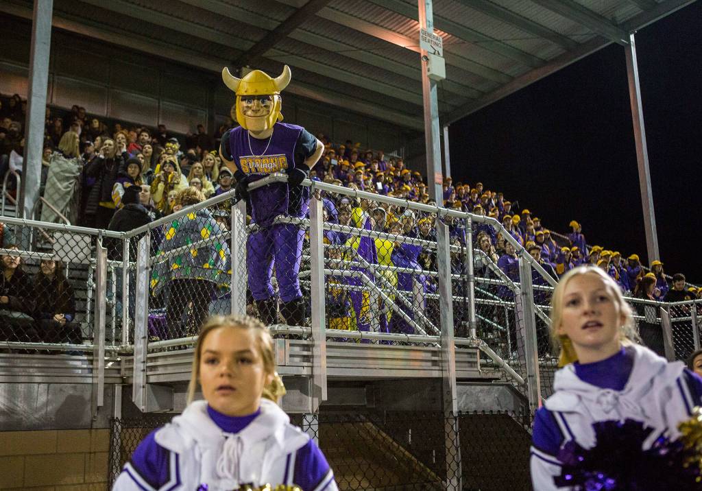 The Lake Stevens student section and band watch a play during the Class 4A state state semifinal game against Woodinville at Pop Keeney Stadium on Saturday, Nov. 24, 2018 in Bothell, Wa. (Olivia Vanni / The Herald)