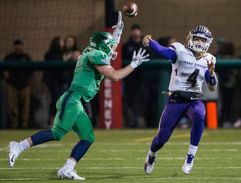 Lake Stevens Tre Long throws the ball during the Class 4A state state semifinal game against Woodinville at Pop Keeney Stadium on Saturday, Nov. 24, 2018 in Bothell, Wa. (Olivia Vanni / The Herald)