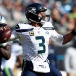 Seahawks quarterback Russell Wilson (3) looks to pass during the first half of Sundays NFL game against the Carolina Panthers. (AP Photo/Mike McCarn)