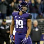 Washington tight end Hunter Bryant smiles after scoring a touchdown during a game against California on Oct. 7, 2017, in Seattle. (AP Photo/Elaine Thompson)