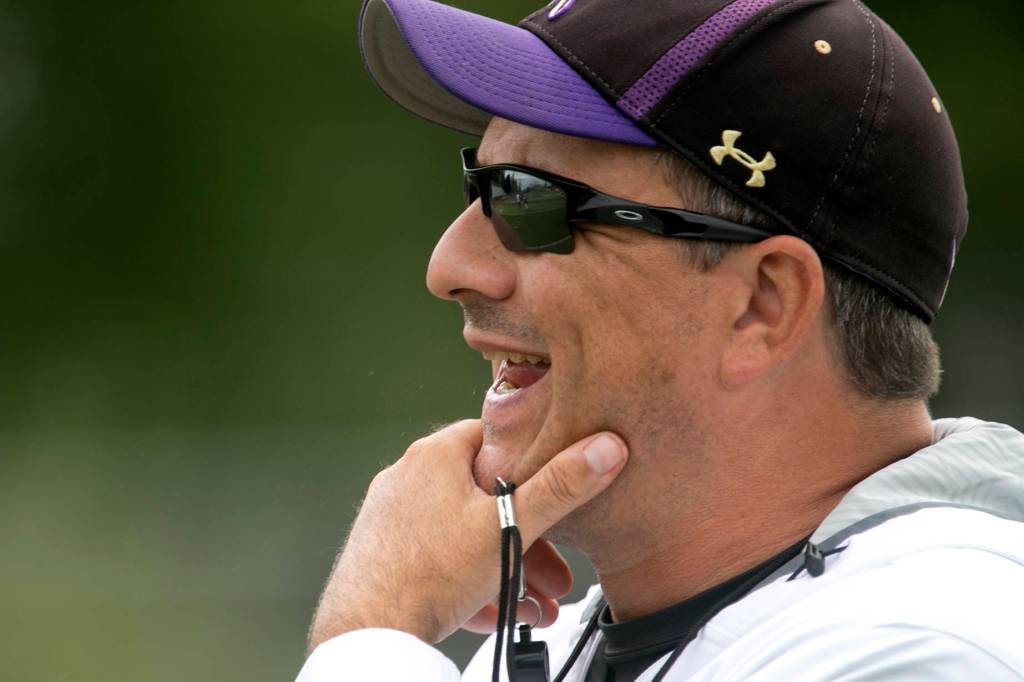 Lake Stevens football coach Tom Tri watches his team during a practice session in August. Tri is in his 14th season as the Vikings head coach. (Kevin Clark / The Herald)